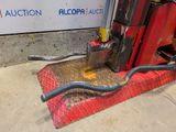 an image of a forklift with a hose attached to it