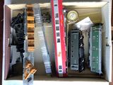 a box with a bunch of toy trains inside of it
