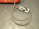a hose and a pressurer on a table