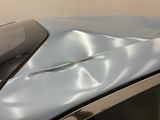 a close up of a car ' s windshield with a damaged windshield