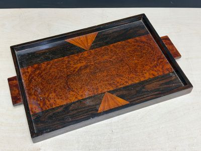 an image of a wooden tray with a design on it