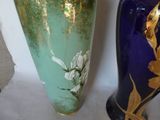 two vases sitting next to each other on a table
