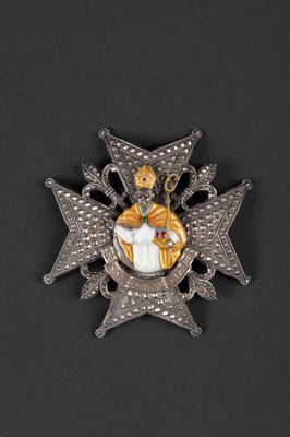 a close up of a badge on a black surface