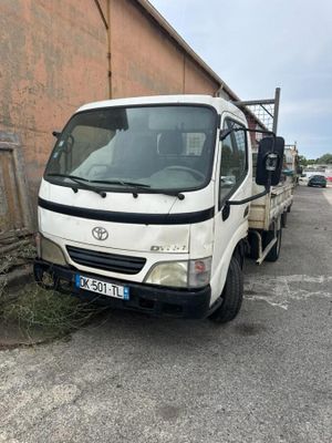 a white truck that is parked on the side of the road