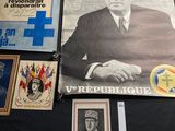 a lot of books and posters on a black table