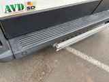a close up of a truck bumper with a sticker on it