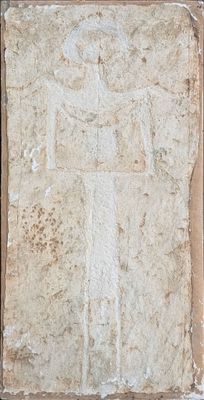 an image of a stone plaque with a figure on it