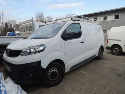 a picture of a white van parked in a parking lot