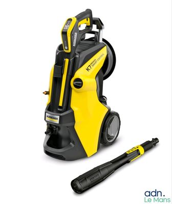 a black and yellow pressurer with a hammer next to it