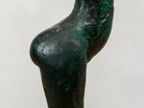 a statue of a woman that is sitting on a table