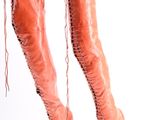 pair of pink leather boots with laces on the toes