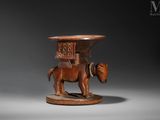 an image of a wooden elephant with a basket on it ' s back