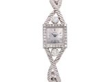an image of a woman ' s wrist watch with diamonds on it