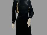 an image of a mannequin dressed in a black dress