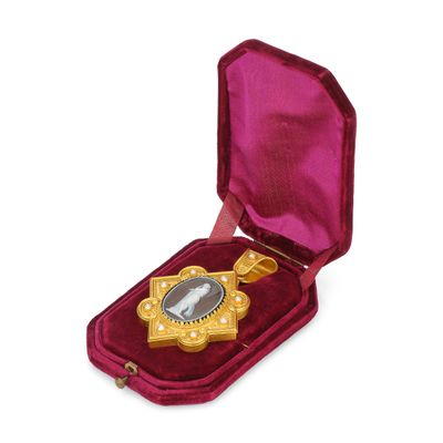 an image of a gold medal in a velvet case on a white background