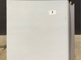 an image of a white refrigerator in a warehouse