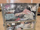 a metal cart with many items in it in a warehouse