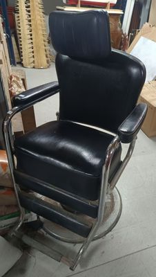 a black chair that is sitting in a room