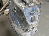 an image of a broken toaster sitting on the floor