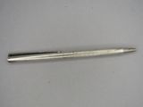 an image of a pen on a white surface