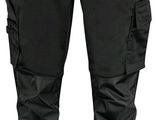 un gros plan sur un pantalon noir sur fond blanc