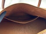 a close up of a brown bag with a handle