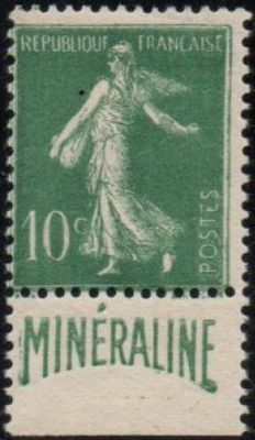 a green and white stamp with a picture of a woman on it