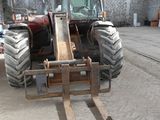 a tractor that is parked inside of a building