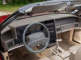 a car dashboard with a steering wheel and a dash board