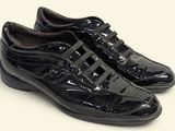 men ' s black dress shoes on a white background