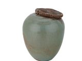 a green vase with a brown lid on a white background