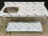 a stainless steel sink with a shelf underneath it
