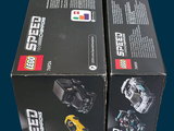 two boxes of lego speed cars sitting on a table