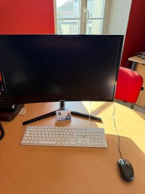 an image of a desk with a computer monitor and keyboard