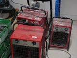 many different types of portable generators in a room