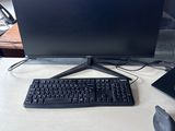 a keyboard, mouse, and monitor on a desk
