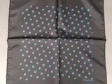 a gray and blue handkerchief with blue flowers on it