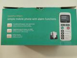someone is holding a box with a cell phone inside of it