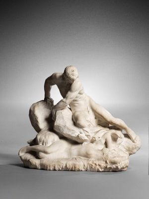 marble statue of a man and a woman sitting on a rock