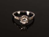 a white gold engagement ring with an old cut diamond
