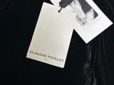 the back of a black dress with a tag on it