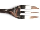 a fork that is on top of a white table