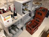 many bottles of wine sitting on the shelves in the room