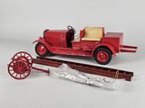 a red model of a fire truck and a wagon