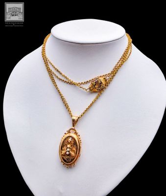 a close up of a necklace on a mannequin mannequin