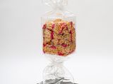 a close up of a bag of cereal on a black stand