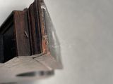 a close up of a window with a wooden frame