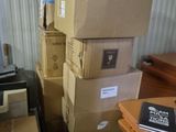many boxes stacked on top of each other in a room