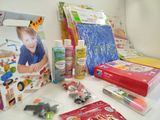 a lot of craft supplies on a table with a picture of a child