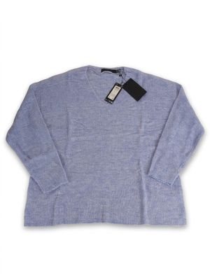a blue sweater with a black label on it